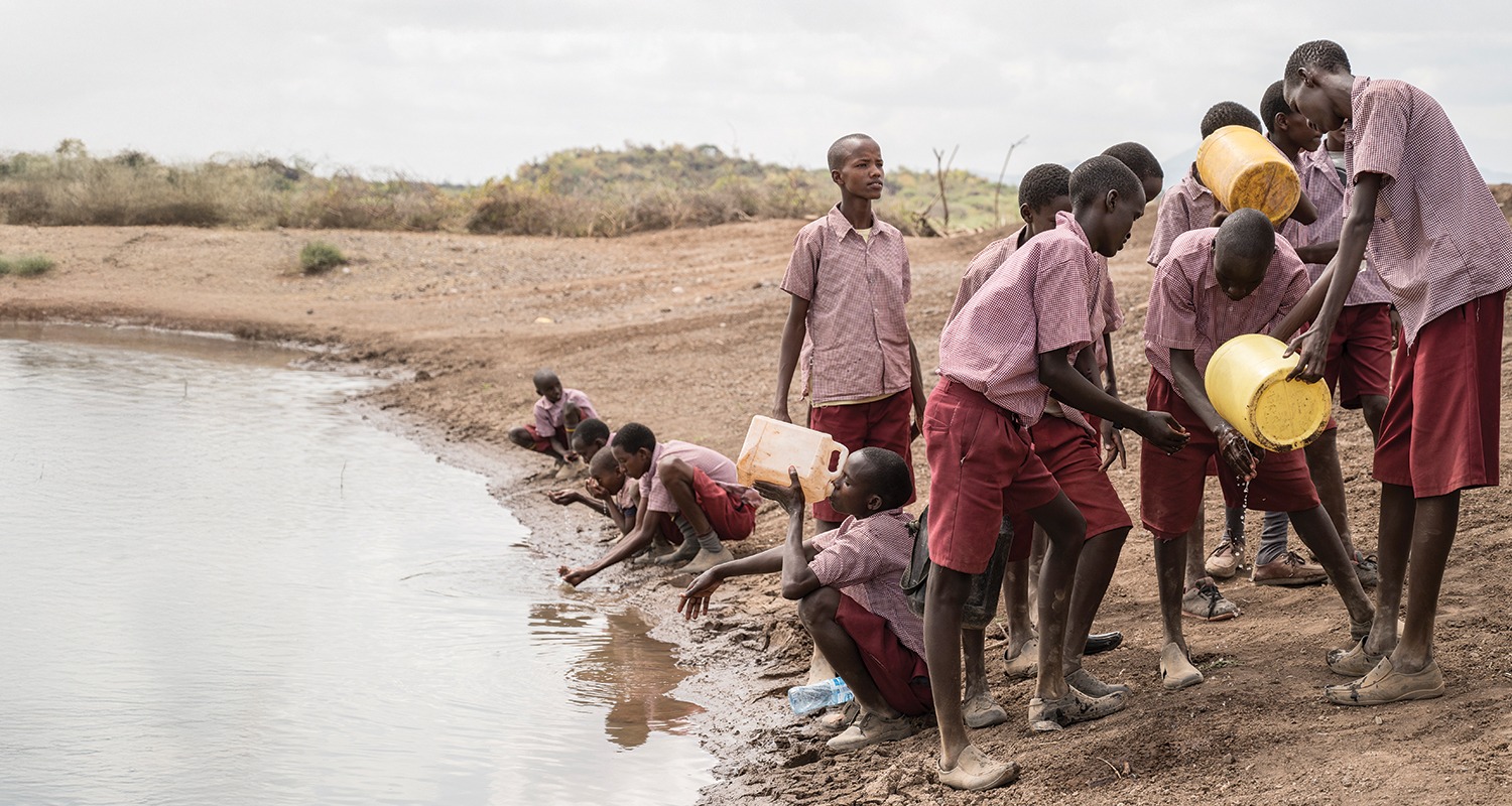 School children in rural Nigeria drinking from unsafe water